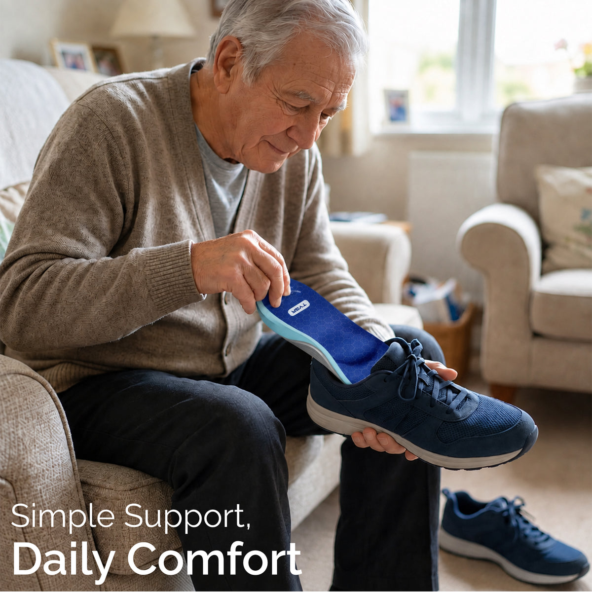 Blue and grey insole being placed into a navy shoe for daily comfort support