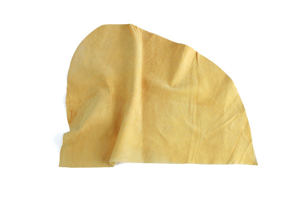 Natural chamois leather hide cut with folded edge, tan suede-like surface