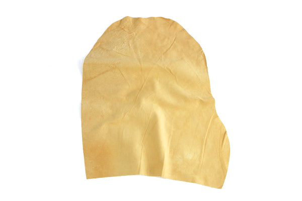 Natural chamois leather hide cut, small irregular tan piece