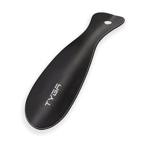 Black metal shoe horn with smooth curved body and oval hanging hole