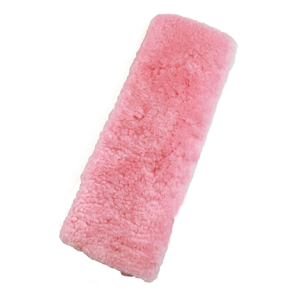 Pink sheepskin seat belt cover with Velcro fastener, rectangular fuzzy strap