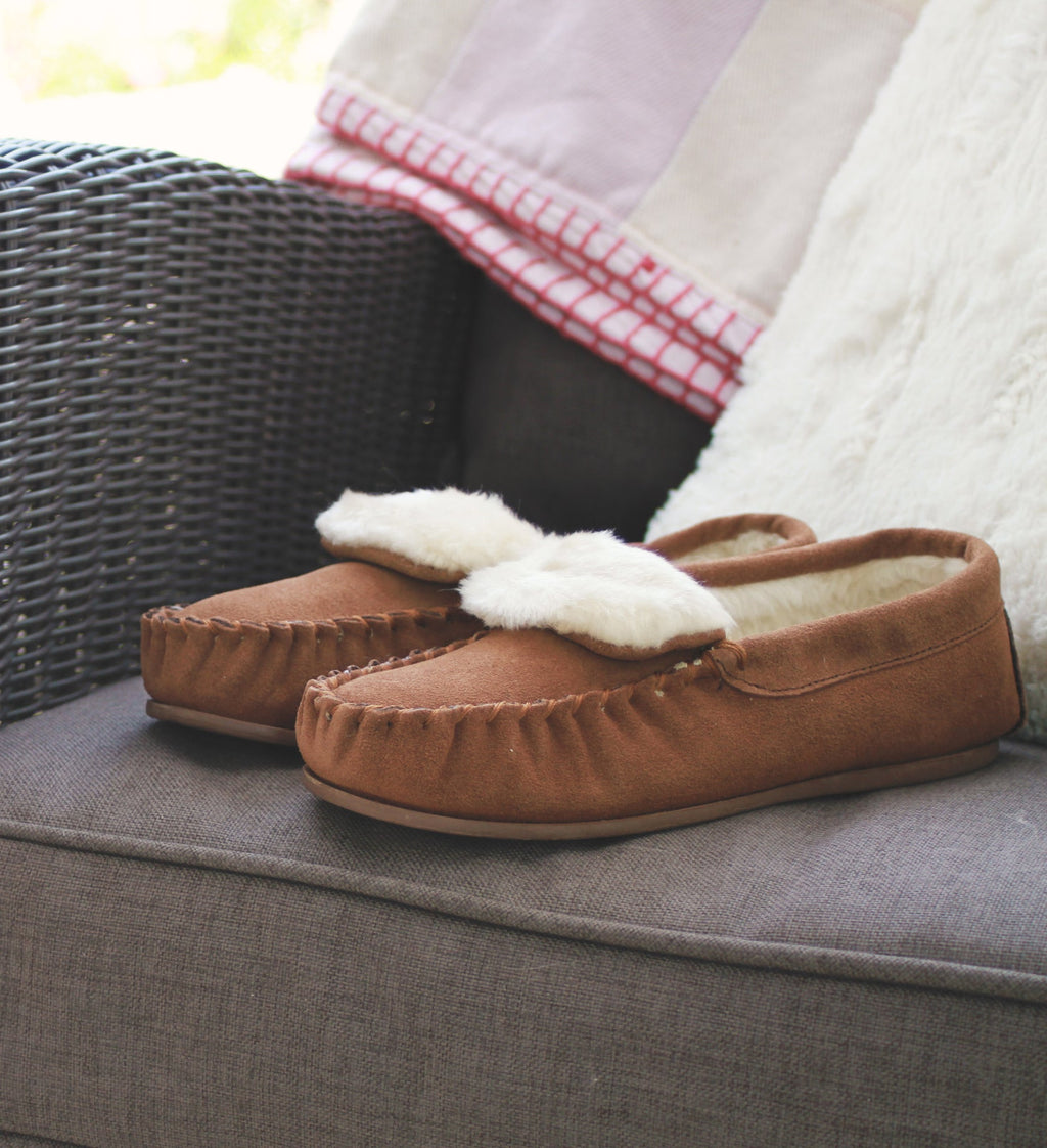 Dark camel moccasin slippers with plush white lining and textured TPR sole