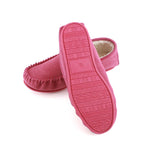 Pink suede moccasin slippers with fleece lining and TPR patterned outsole, heel view