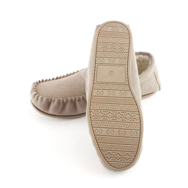 Stone suede moccasin slipper showing patterned outsole and plush interior lining