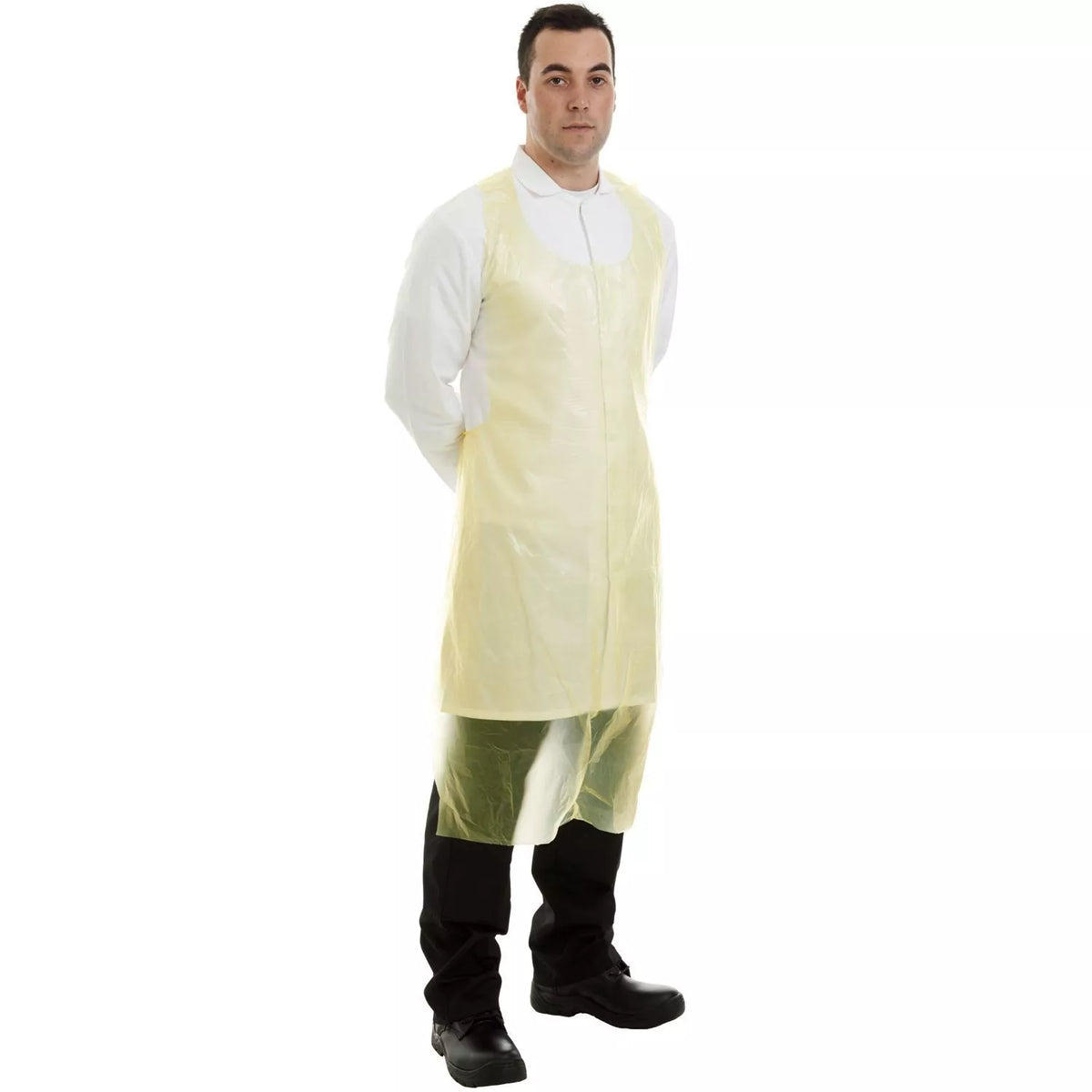 Yellow disposable PE apron, long sleeveless design shown worn