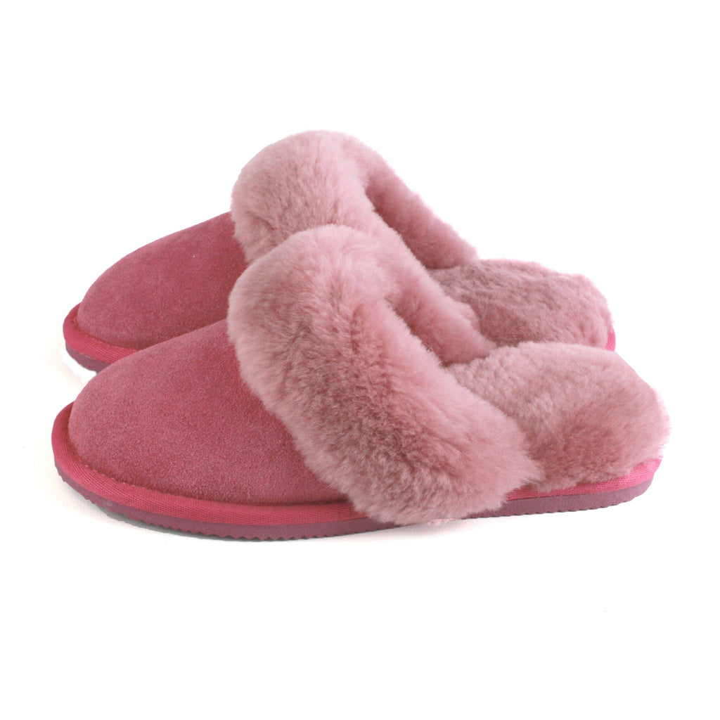 Pink sheepskin mule slippers with fluffy crossover strap and EVA sole