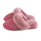 Pink sheepskin mule slippers with fluffy crossover strap and EVA sole