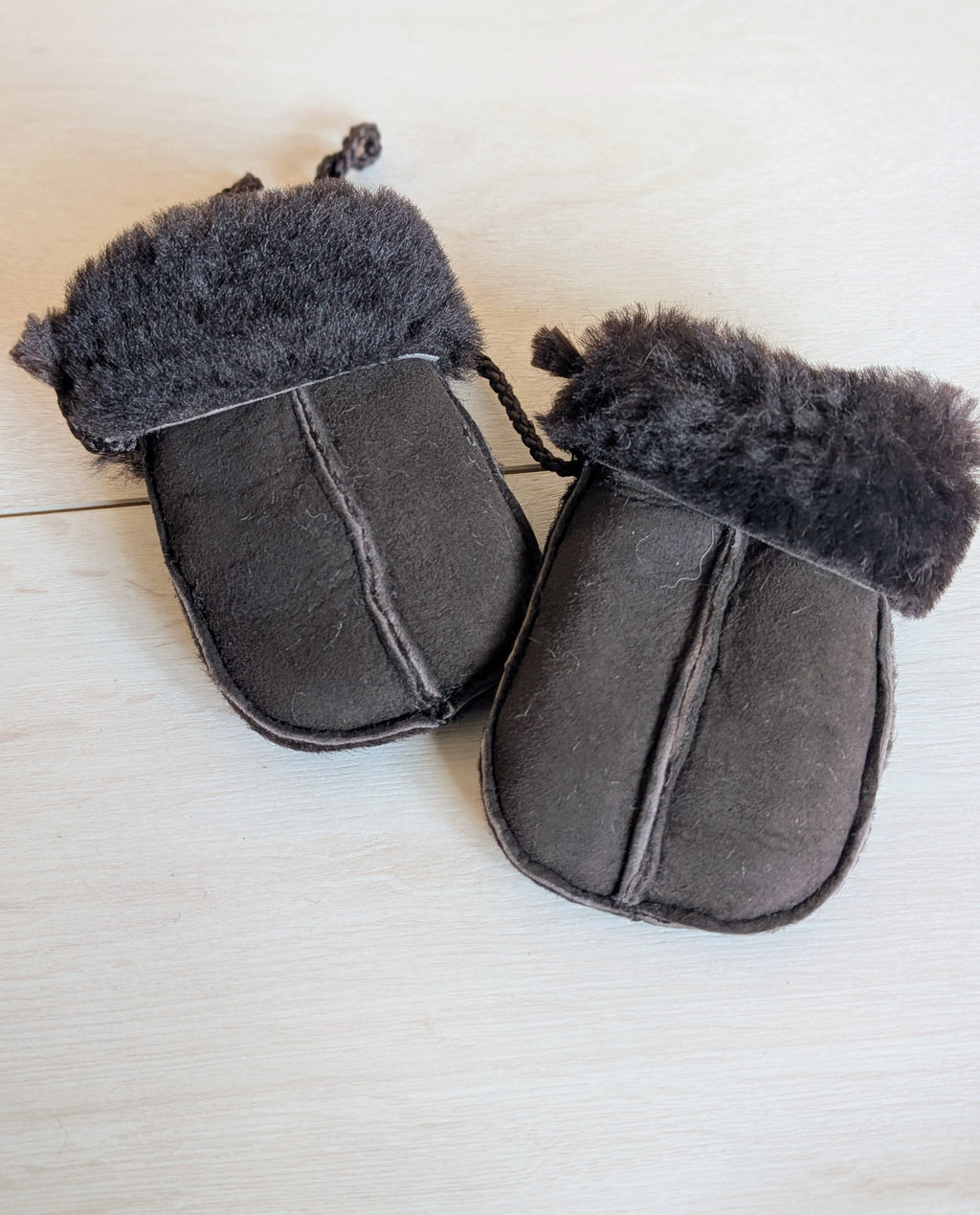 Baby sheepskin mittens with split palm and turn-back cuffs, dark charcoal